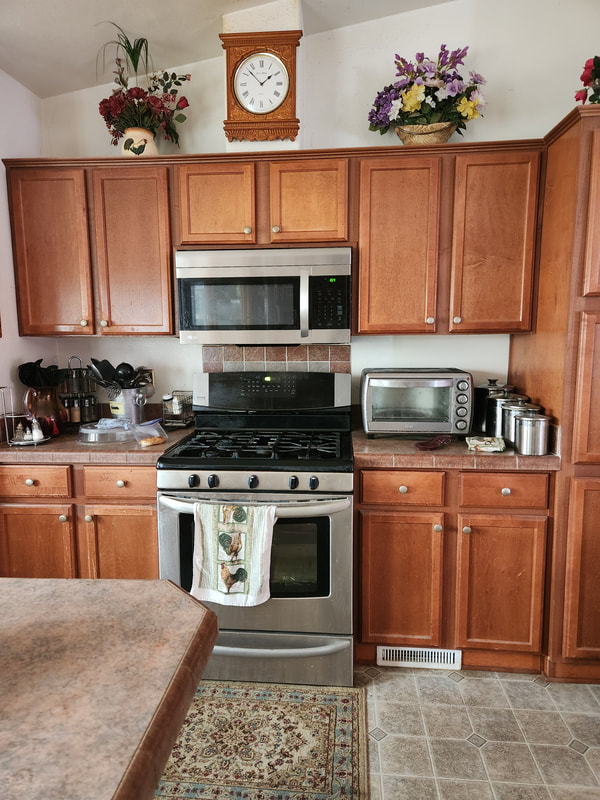 Kitchen with Steel Stove, Oven, and Microwave
